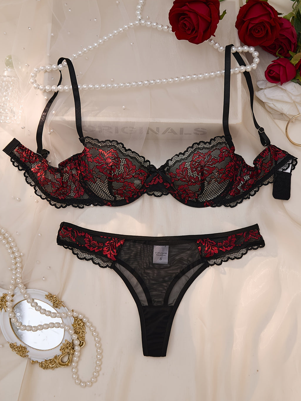 Sexy black and red lace lingerie set with breathable see-through fabric, push-up bra, and matching panties for romantic holiday or winter wear.