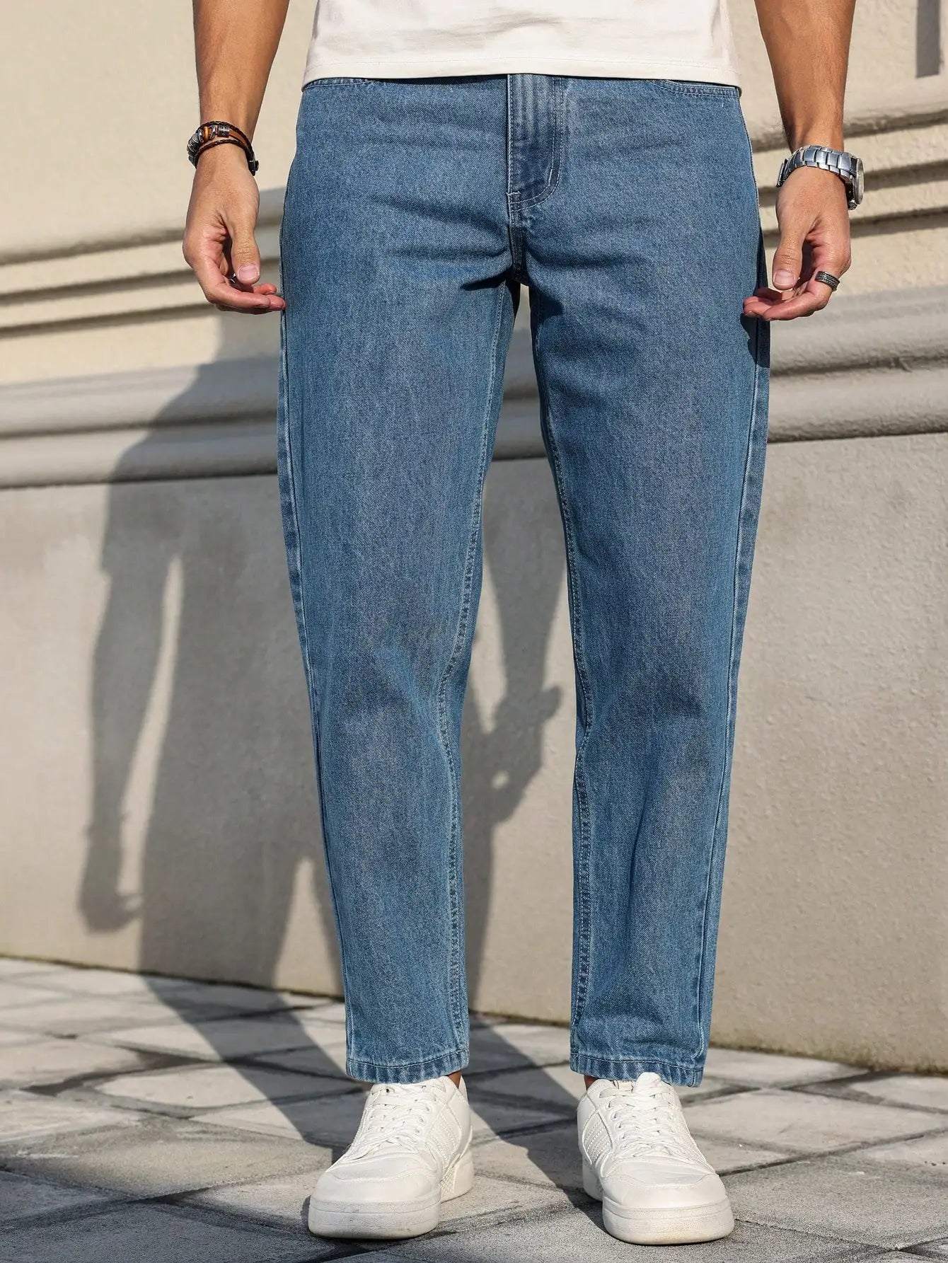 Men’s classic blue denim jeans with a loose fit, perfect for casual everyday wear in the US and Canada, timeless and versatile wardrobe essential