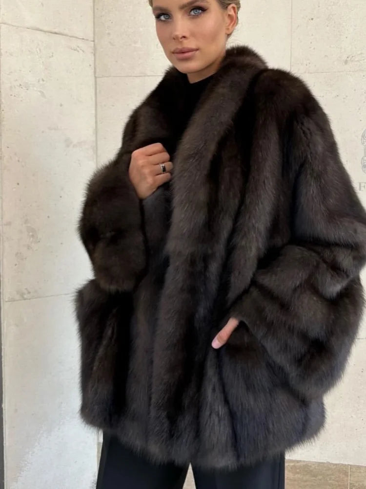 Fashion plush faux fur coat for women with elegant V-neck full sleeves loose fit warm medium length jacket ideal for daily commute and streetwear.