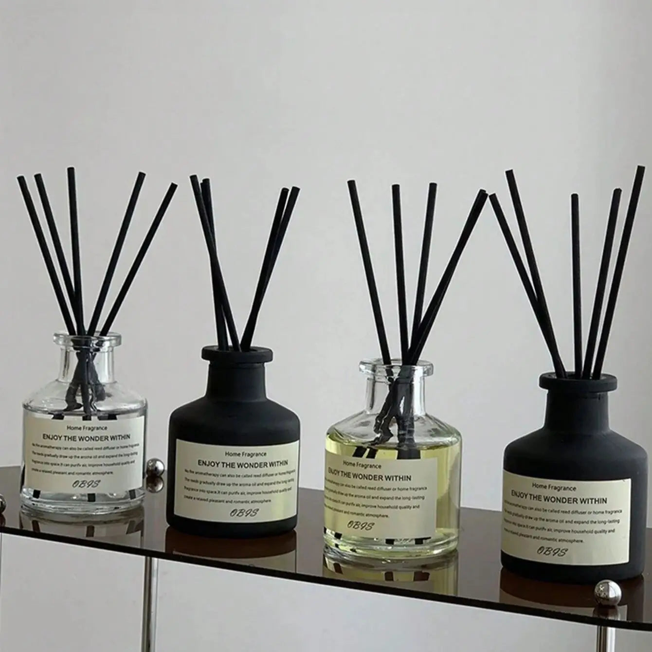 50ml flameless home fragrance diffuser with jasmine and freesia scent, includes reed sticks, perfect for freshening and decorating any room.
