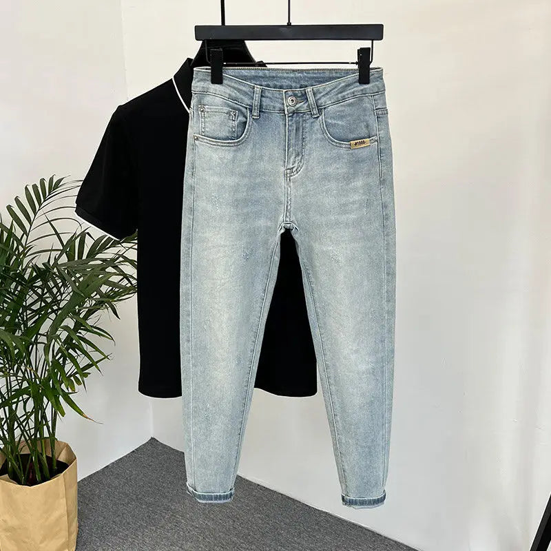 Light wash slim fit jeans for men with a trendy streetwear design, ideal for youthful everyday fashion in the US and Canada